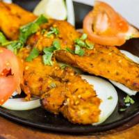 Fish Tandoori (2 Pieces) · Medium. Fish marinated and barbecued in clay oven to its perfection.