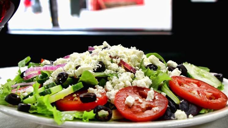 Greek · Romaine lettuce and mixed greens, tomatoes, cucumbers, red onions, olives, Feta cheese, green bell peppers.