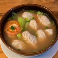 Mo-Thuk · Hand-wrapped dumplings stuffed with beef, tomatoes and bok choy in a house-made broth.