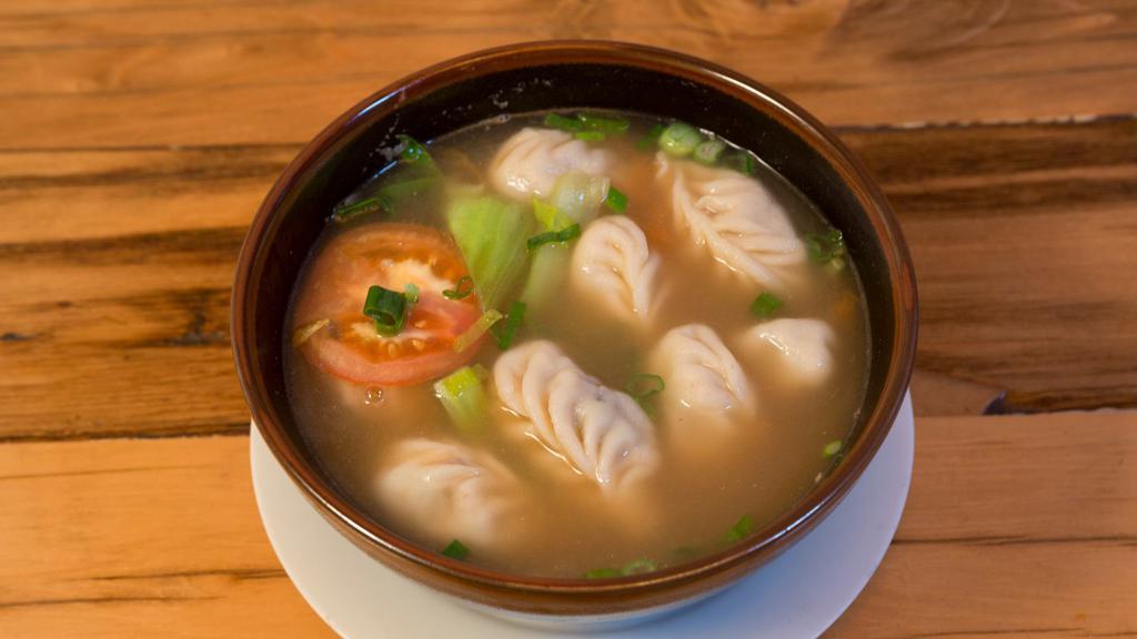 Mo-Thuk · Hand-wrapped dumplings stuffed with beef, tomatoes and bok choy in a house-made broth.