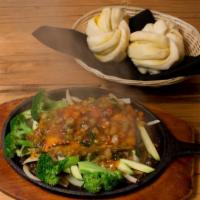Grilled Salmon · Served over veggies topped  with mild sweet chili sauce on a sizzling plate.