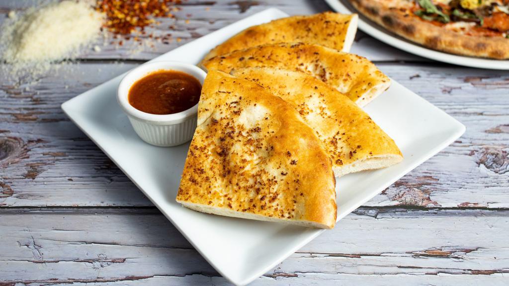 Florence's Garlic Focaccia with Marinara Dipping Sauce · Oven baked housemade Italian bread flavored with extra virgin olive oil & garlic and served with marinara dipping sauce.