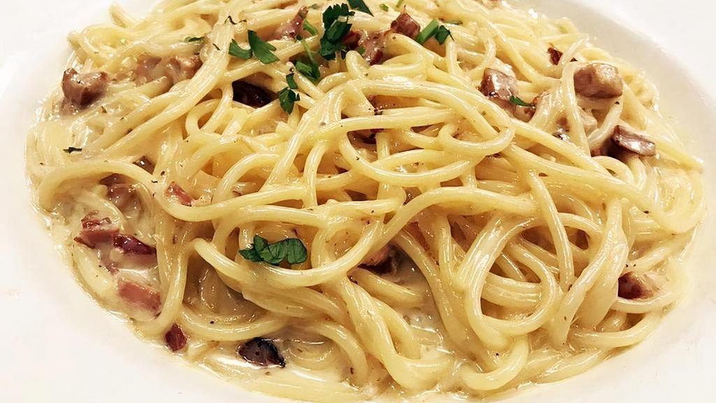 SPAGHETTI CARBONARA.. · pancetta (italian bacon), onion, garlic, white wine, cream, asiago cheese