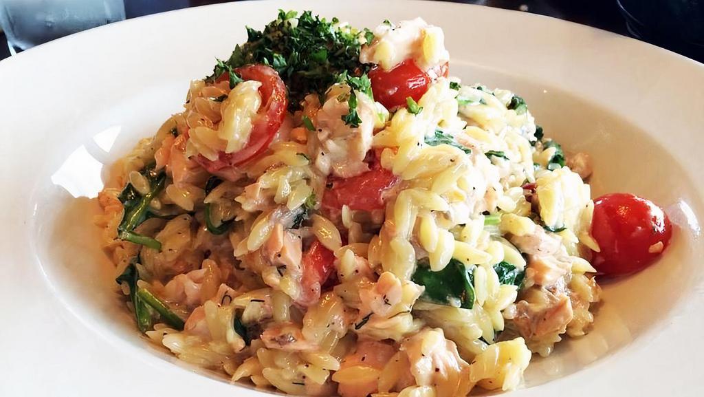 ORZO SALMON.. · Grilled salmon tossed with orzo pasta, cherry tomatoes, baby spinach, fresh dill, lemon, white wine, cream, butter, garlic