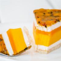 Coconut Passion Fruit Aurora · White cake with coconut cream, diced pineapples in rum, with mango passion fruit, and strawb...