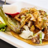 Tacos · Choice of meat with onion, cilantro and salsa.