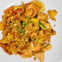 Pineapple Fried Rice · Steamed jasmine rice sauteed with prawns, chicken, egg, pineapple, onion, carrots, tomatoes,...