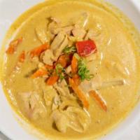 Yellow Chicken Curry · Aromatic yellow curry paste, yellow onion, carrots, red bell peppers and potatoes and infuse...