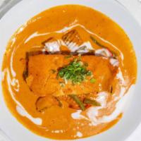 Pumpkin Salmon Curry · Wild Alaskan salmon fillet in creamy pumpkin curry sauce with red bell peppers, pumpkin, gre...