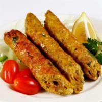 Chicken Seekh Kebab · Flavorful chicken topped with fennel, herbs, and spices.
