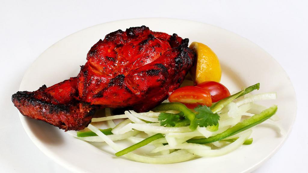 Chicken Breast Tandoori · Chef's spicy yogurt marinade over chicken breast cooked in charcoal clay oven.