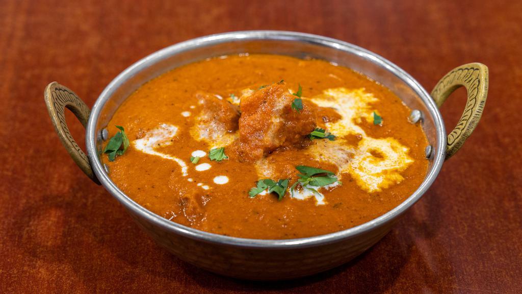 Mild Chicken Tikka Masala · Chunks of chicken that are marinated in a yogurt and spice mixture, roasted in a tandoor, and served in a rich tomato-based sauce. Chef recommends Garlic Naan for the mild Chicken Tikka Masala.