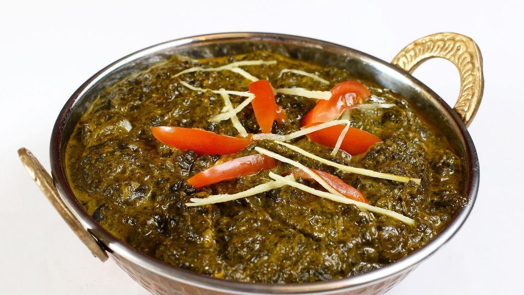 Murgh Palak  · Boneless free range chicken cooked with spinach and spices