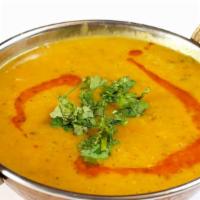 Yellow Tarka Daal · Cooked lentils tempered with Indian spices and herbs.