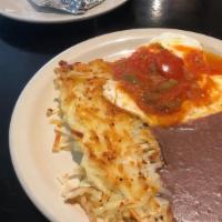 Eggs Rancheros · Two eggs topped with our homemade ranchero sauce, and refried beans.