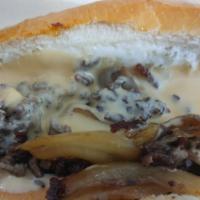 O.G. Cheesesteak · Grilled steak or chicken, grilled onions, mayo, and Cheddar cheese sauce.