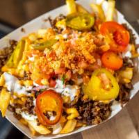 Cheat Day Fries · Cheddar Jack cheese, cherry peppers, sour cream, firecrackin' sauce (mild-med spice), pico d...