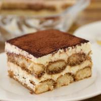 Mama Rosa's Homemade Tiramisu · Rum and espresso-soaked sponge cake, layered with sweet mascarpone and chocolate cream, fini...