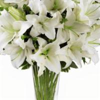 Dixon May Fair Lilies · DESCRIPTION: White oriental lilies.  Bouquet arrives in clear vase. Clear vase and flower fo...