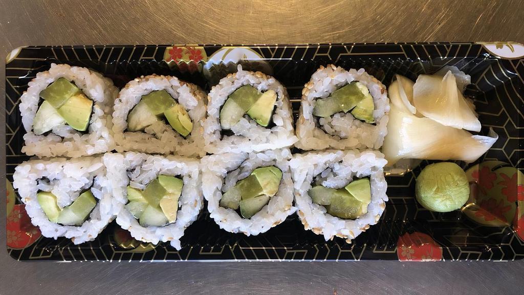 Veggie Roll · Avocado, cucumber, takuan: yellow pickled radish, topped with sesame seeds.