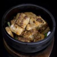 710. Daikon & Dried Shrimp Cake with X.O. Sauce · In stone clay pot.