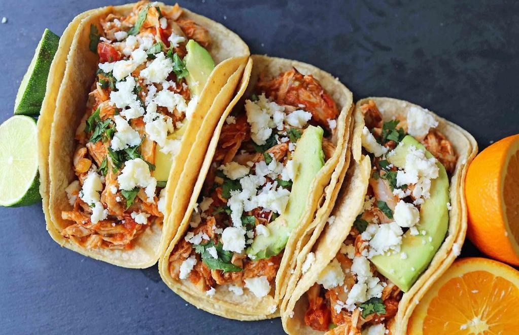 Chicken Tinga Tacos. · (three) guacamole, sour cream and cotija cheese in a corn tortilla served with black beans and housemade tortilla chips