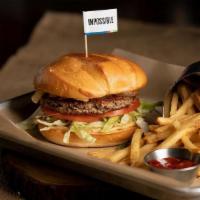 Impossible Burger... · burger patty made entirely from plants for people who love meat. served with caramelized oni...