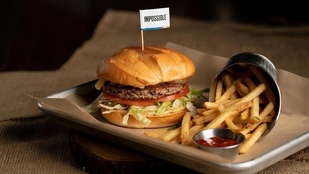 Impossible Burger... · burger patty made entirely from plants for people who love meat. served with caramelized onions, tomatoes, lettuce, and house spread on a brioche bun * bun contains egg. choice of one side. *vegetarian*