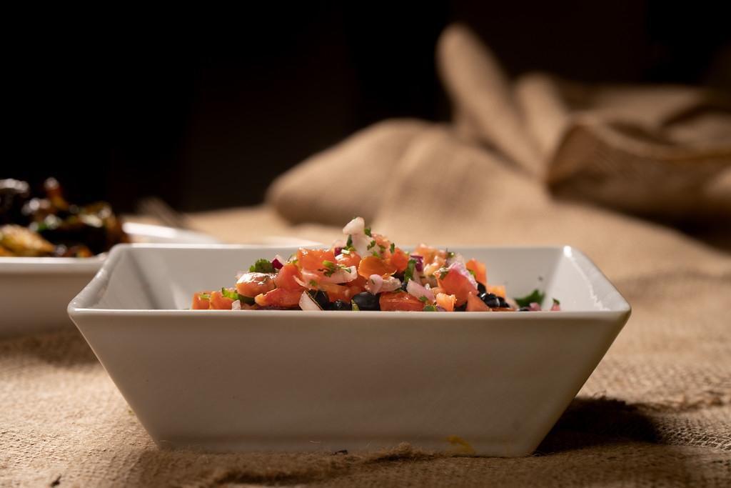 Black Beans. · braised black beans topped with pico de gallo