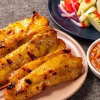 Chicken Satay · Chicken skewers marinated in herbs and spices, served with peanut sauce and cucumber salad.