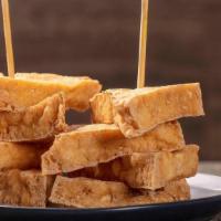 Golden Triangle · Golden brown deep fried tofu serve with sweet chili sauce and crush peanuts
