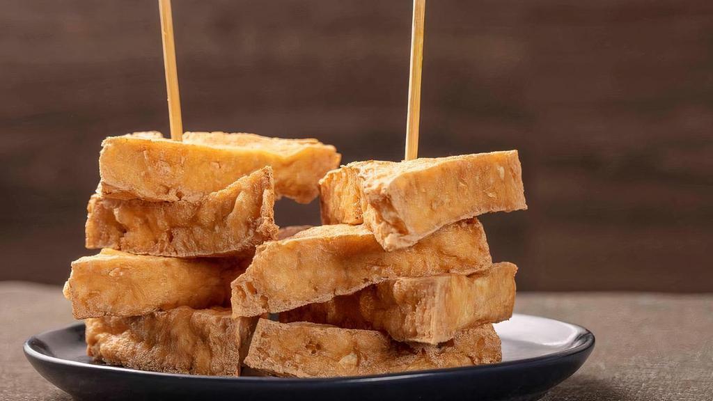 Golden Triangle · Golden brown deep fried tofu serve with sweet chili sauce and crush peanuts