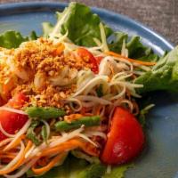 Papaya Salad · Shredded green papaya, tomato, green bean, carrot and ground peanuts tossed in chili-lime dr...