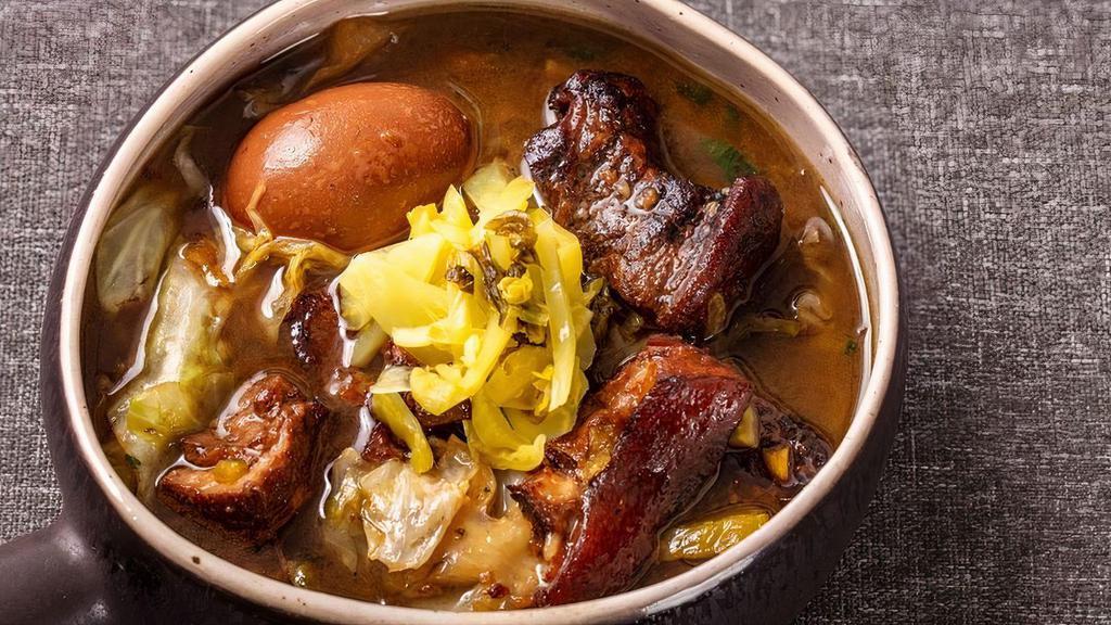 Lek’s Pork Palo · Our mother’s specialty! Pork and egg slow-cooked in a Chinese five spice stew for over three hours; served with a side of pickled cabbage. This dish is often requested at family get-togethers and temple events.