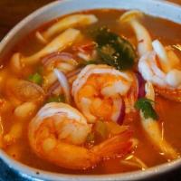 Tom Yum · Spicy sour soup with your choice of chicken, tofu, or prawns, mushrooms, lemongrass, kaffir ...