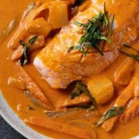 Salmon Delight · Salmon cooked in red curry and coconut milk with onions, pine apple and carrot