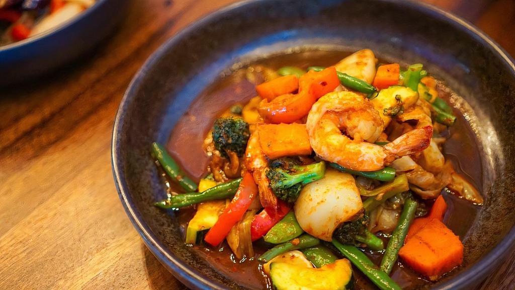 Pad-Ta-Lay · Sautéed prawns, calamari, and salmon, cooked with mixed vegetables in spicy sauce.