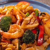 Pad Kee Mao · Rice noodle with choice of protein*, snap peas, broccoli, onion, bell pepper, tomato, and fr...
