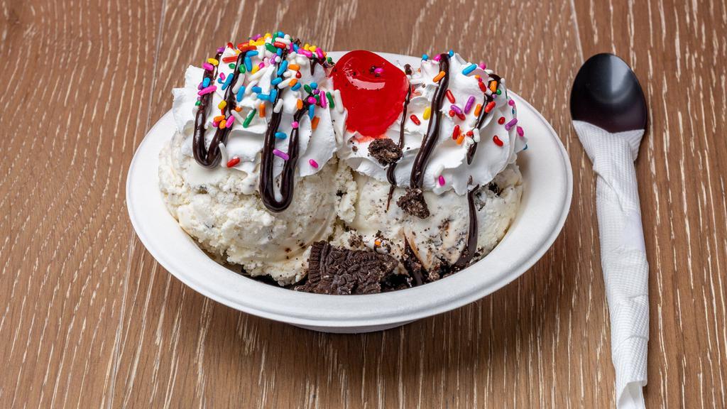 Regular Sundae · 2 scoops of ice cream, 4 toppings, whipped cream and cherry.