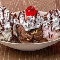 Monster Sundae · 3 scoops of ice cream, 4 toppings, whipped cream and cherry.