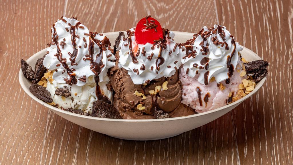 Monster Sundae · 3 scoops of ice cream, 4 toppings, whipped cream and cherry.