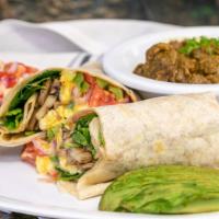 Mary's Little Lamb Shawarma Breakfast Burrito · Lamb shawarma, onions, tomatoes, bell peppers in flour tortilla with eggs, beans, and cheese.