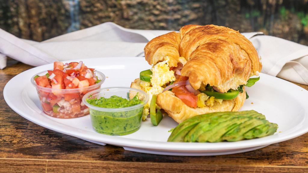 Classic Egg & Cheese Croissant · Scrambled egg and cheddar cheese served on bread.