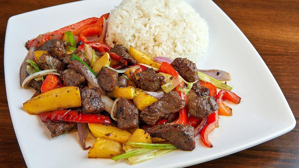 House Steak · Diced Steak marinated with house blend of seasoning & sauce sautéed with onion, zucchini, red bell pepper and green onion.