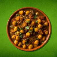 Spiced Chickpea Fiesta · Delicious chickpeas cooked in an exotic blend of  Indian spices and garnished with cilantro.