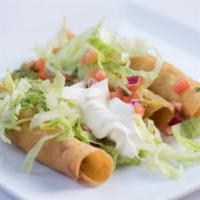 Flautas · 3 Rolled tortilla filled with shredded chicken, crispy fried and served with lettuce, sour c...