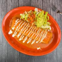 Burrito Famoso · Your choice of meat in a flour tortilla with beans, rice, lettuce, tomatoes, onion, smothere...