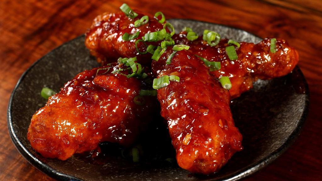 Spicy Glazed Chicken Wings (4) · Fried wings glazed in a honey-chili sauce.