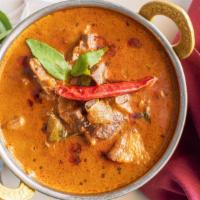 Goat Curry · Goat cooked in onion gravy, Kerala style preparation.