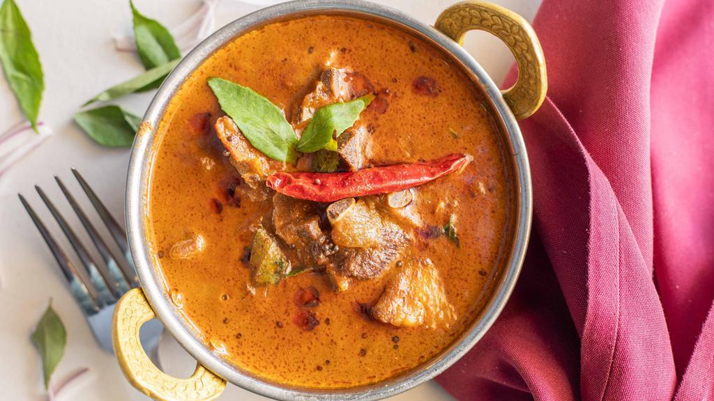 Goat Curry · Goat cooked in onion gravy, Kerala style preparation.